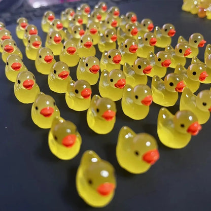 Mini resin ducks in moss garden