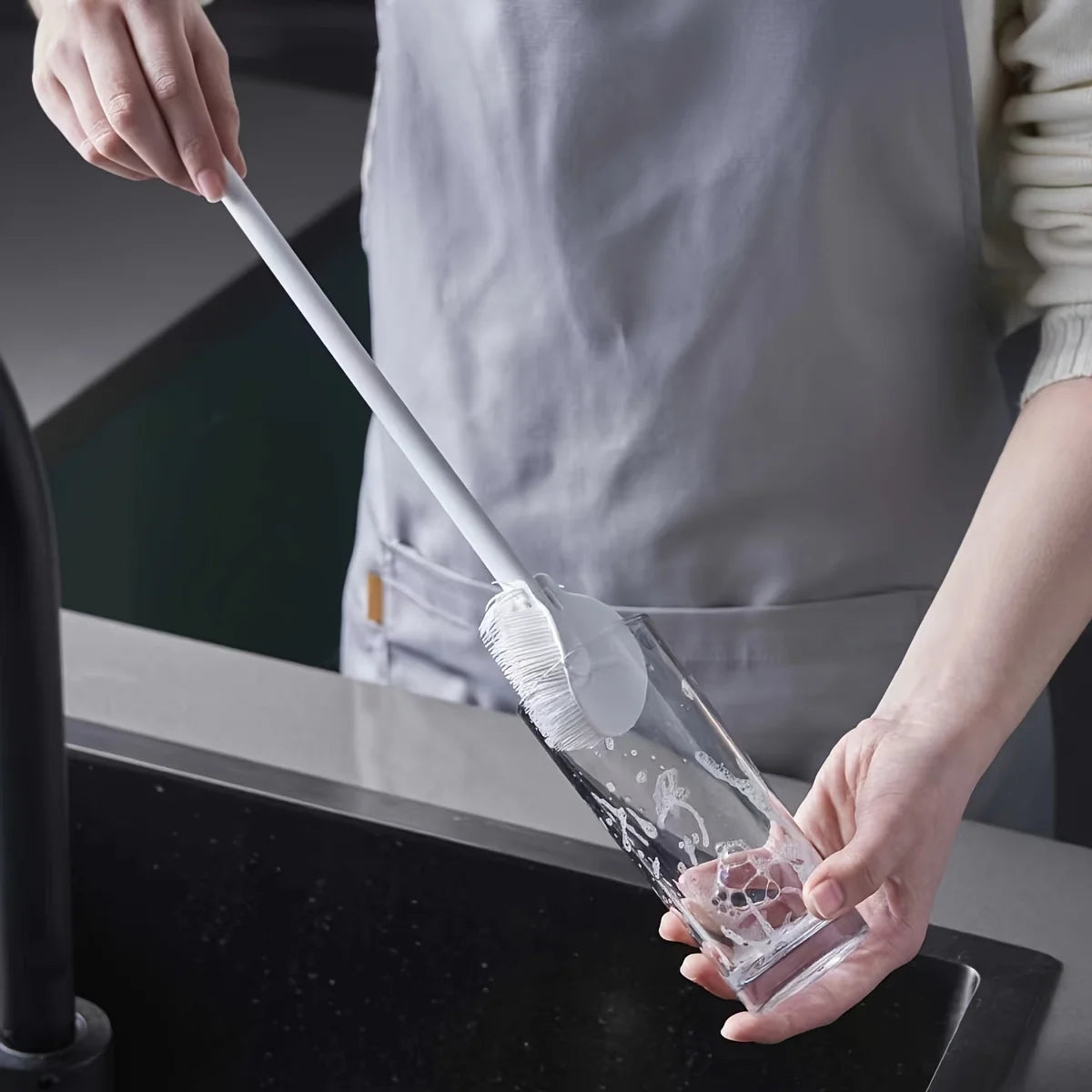 Silicone brush cleaning a bottle